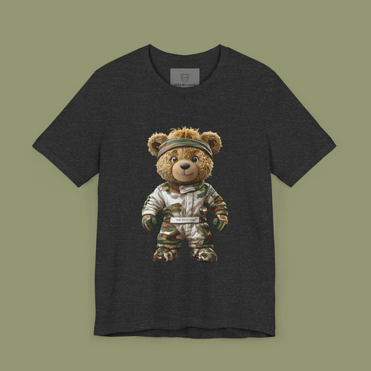 A teddy bear with messy hair wearing a military green racing suit with dirt patches and a bandana on a dark grey heather unisex t-shirt