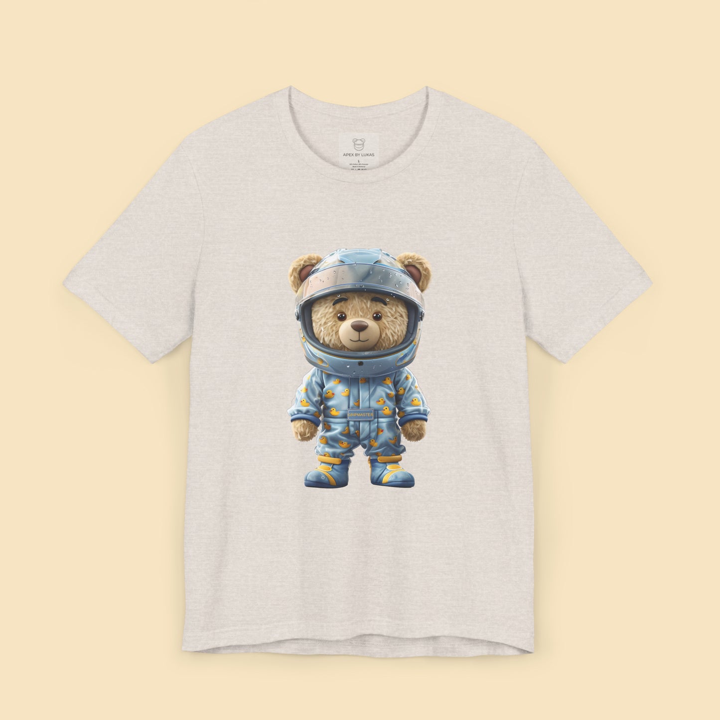 Grip Master teddy bear wearing a light blue karting racing suit with cute rubber duck pattern and light blue helmet on a heather dust color unisex streetwear t-shirt