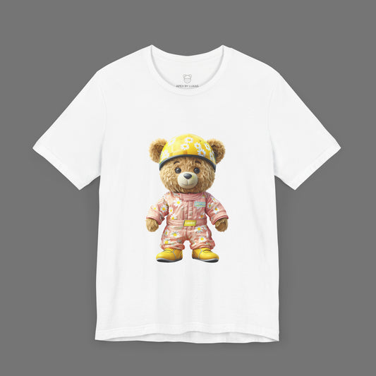 Daisy teddy bear wearing a light pink karting racing suit with daisy floral pattern and yellow helmet on a white unisex streetwear t-shirt