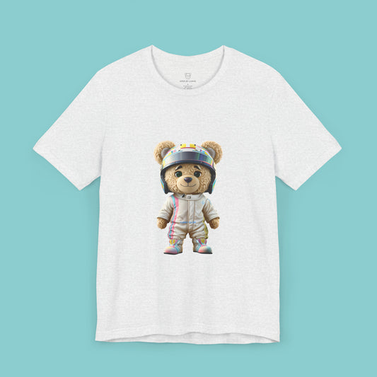 Teddy bear wearing a karting racing suit in beige color with light pink and blue lines on the side and a helmet on an ash t-shirt