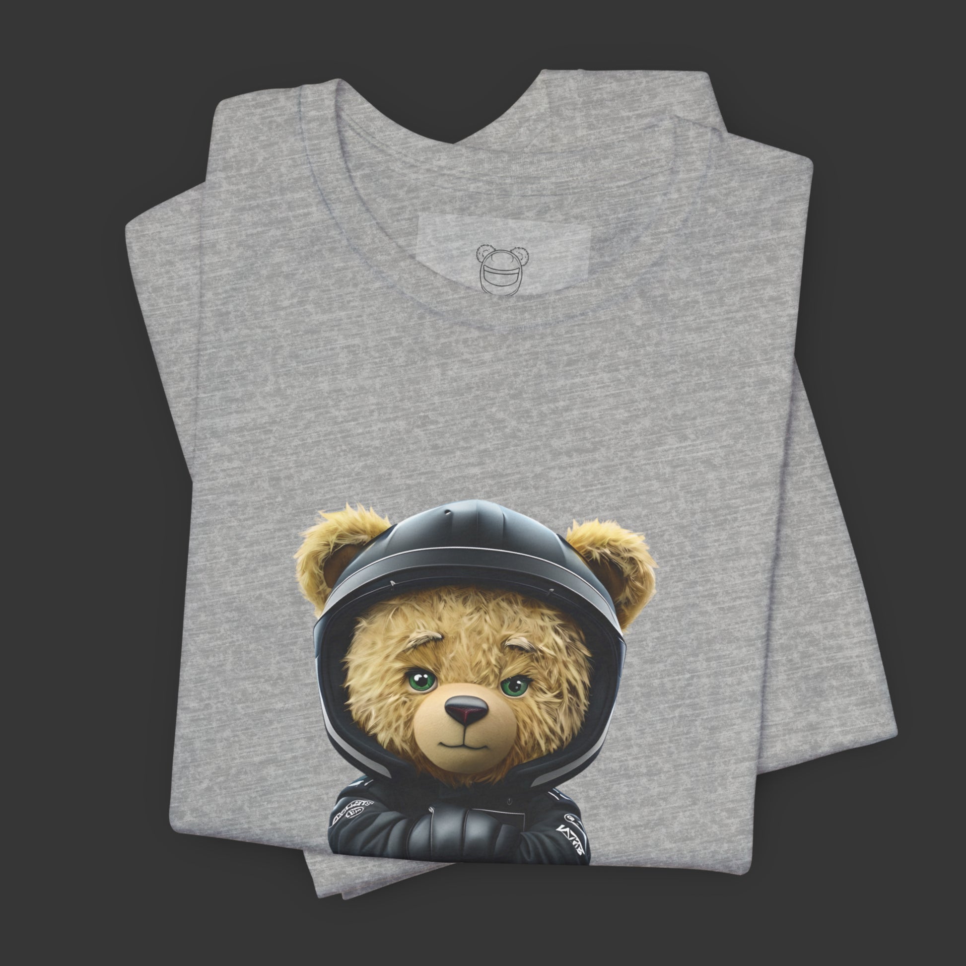 A serious yet cute teddy bear wearing a black karting racing suit with a yellow lightning bolt and a helmet on an athletic heather unisex t-shirt