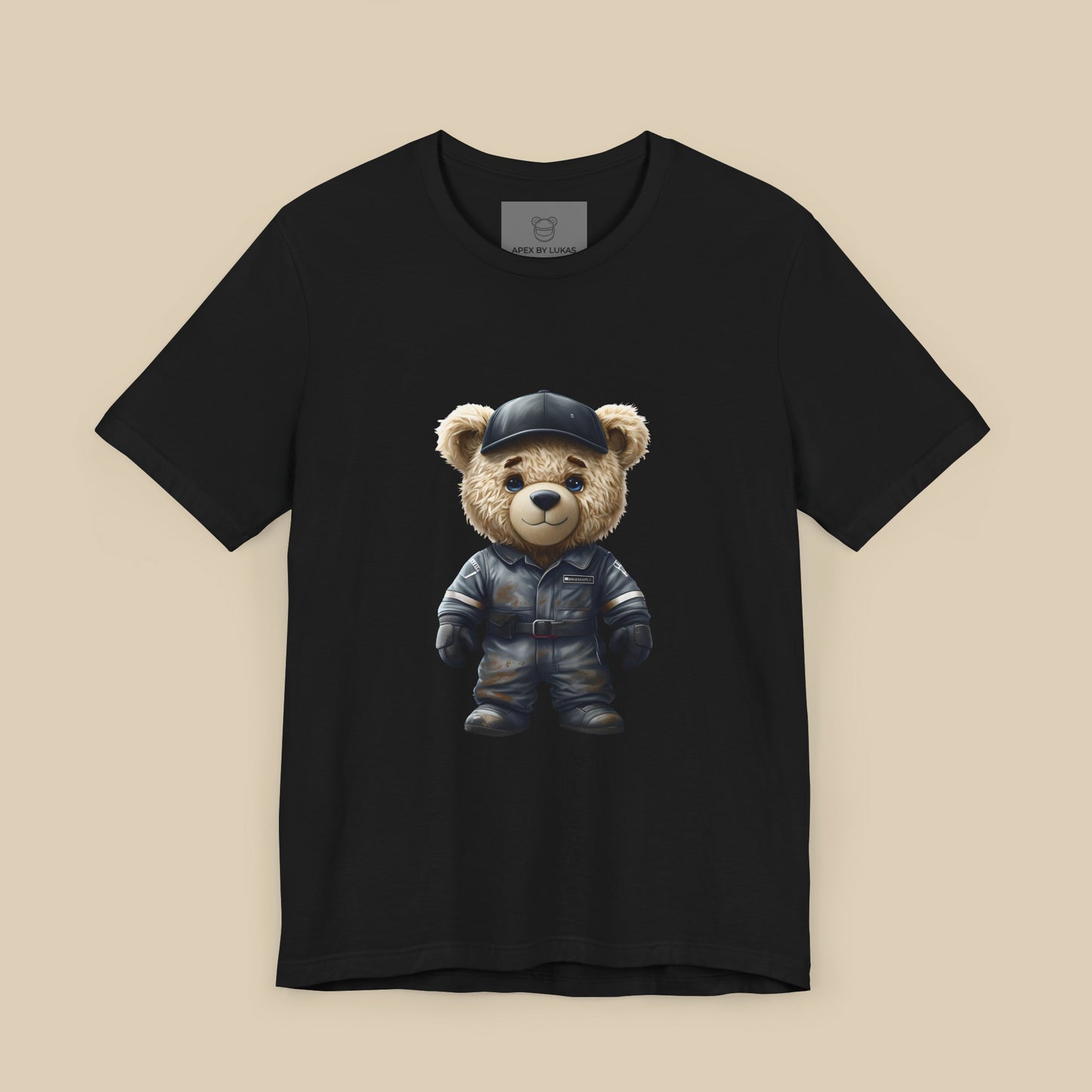 A teddy bear wearing a dark grey, dirty karting racing mechanic suit on a black unisex t-shirt