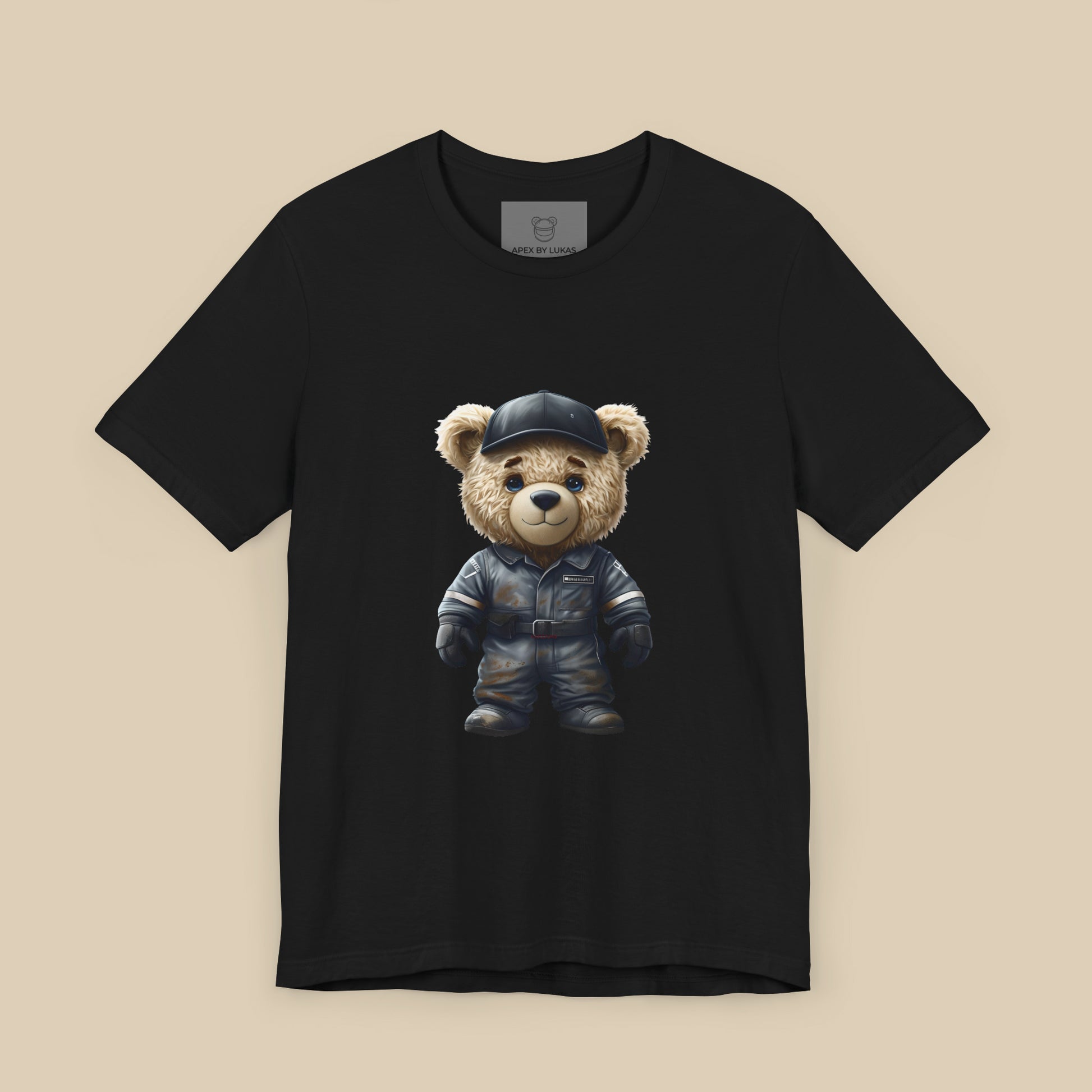 A teddy bear wearing a dark grey, dirty karting racing mechanic suit on a black unisex t-shirt