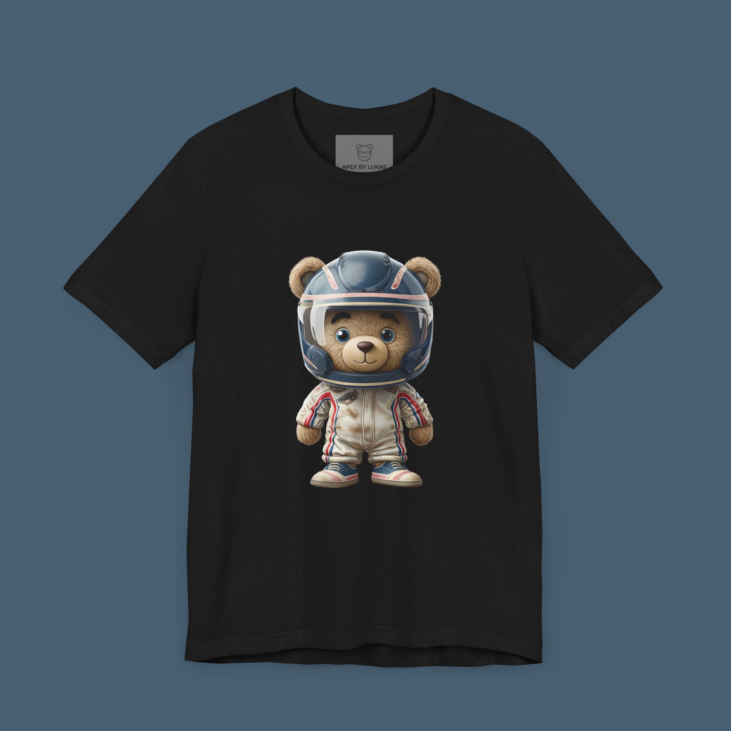 A teddy bear wearing vintage retro beige karting racing suit with red, blue accents and dirt patches and blue helmet on a unisex black t-shirt