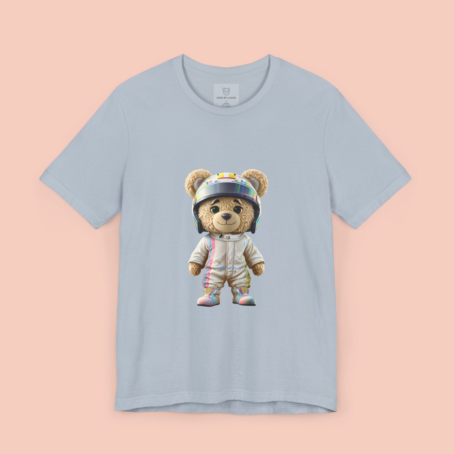 Teddy bear wearing a karting racing suit in beige color with light pink and blue lines on the side and a helmet on a light blue t-shirt