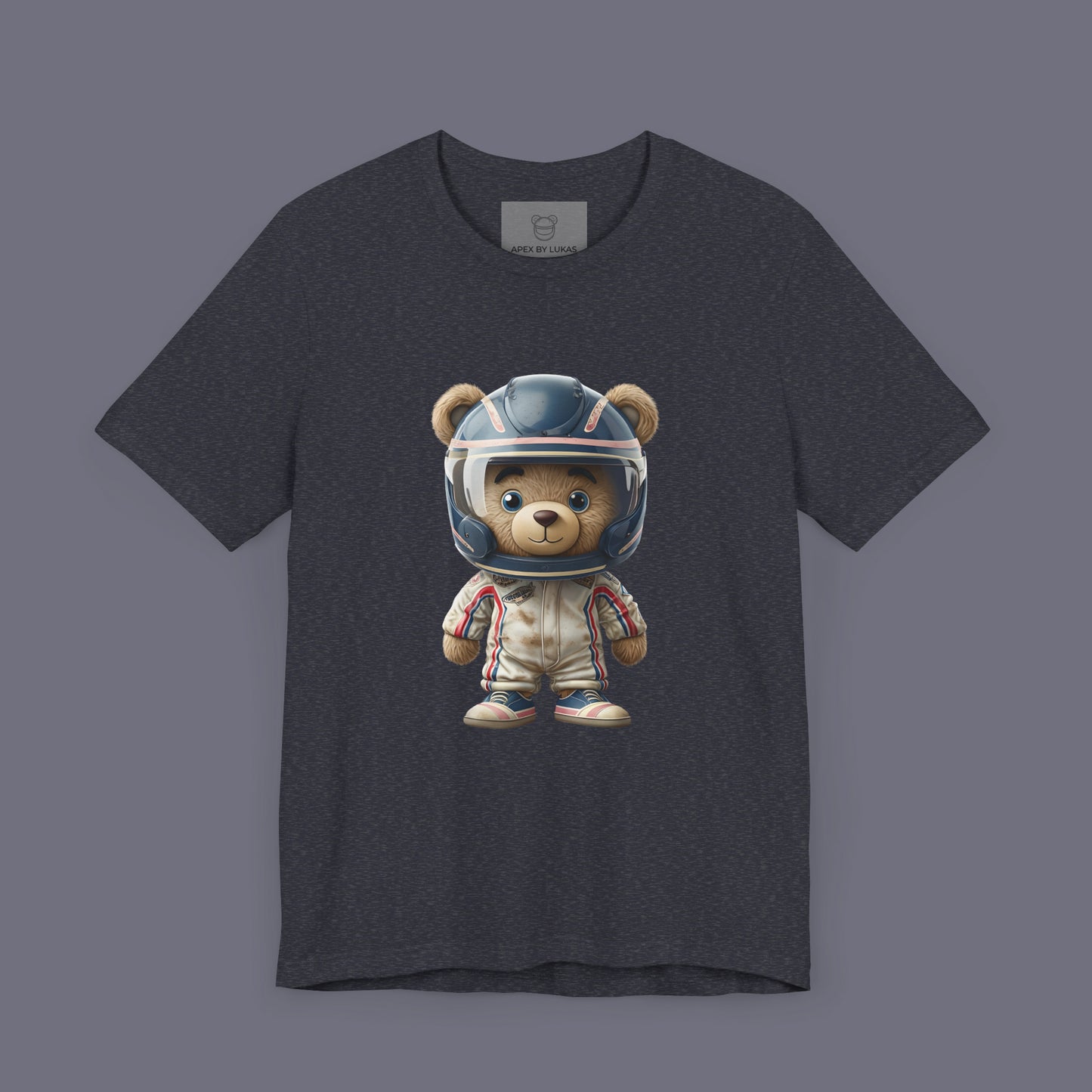 A teddy bear wearing vintage retro beige karting racing suit with red, blue accents and dirt patches and blue helmet on a unisex heather navy t-shirt