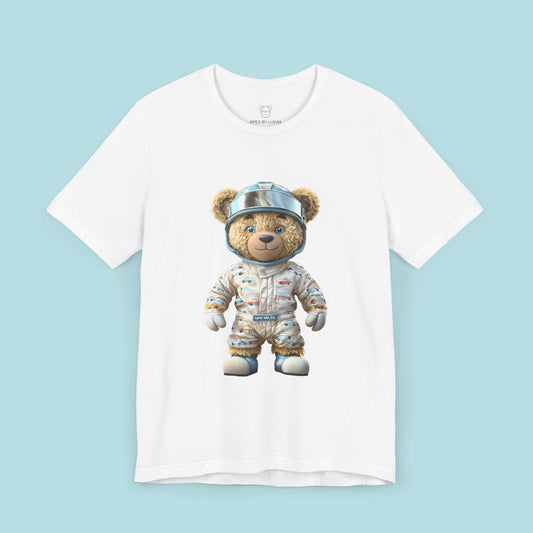 A teddy bear wearing beige karting racing suit with cute car pattern and helmet with chrome visor on a white t-shirt