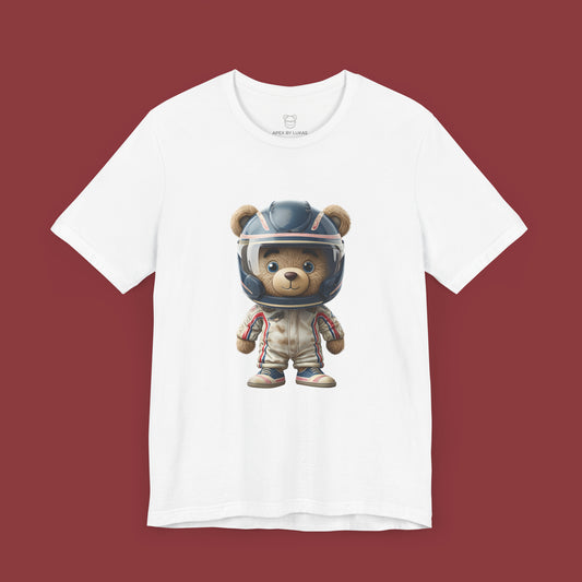 A teddy bear wearing vintage retro beige karting racing suit with red, blue accents and dirt patches and blue helmet on a unisex white t-shirt