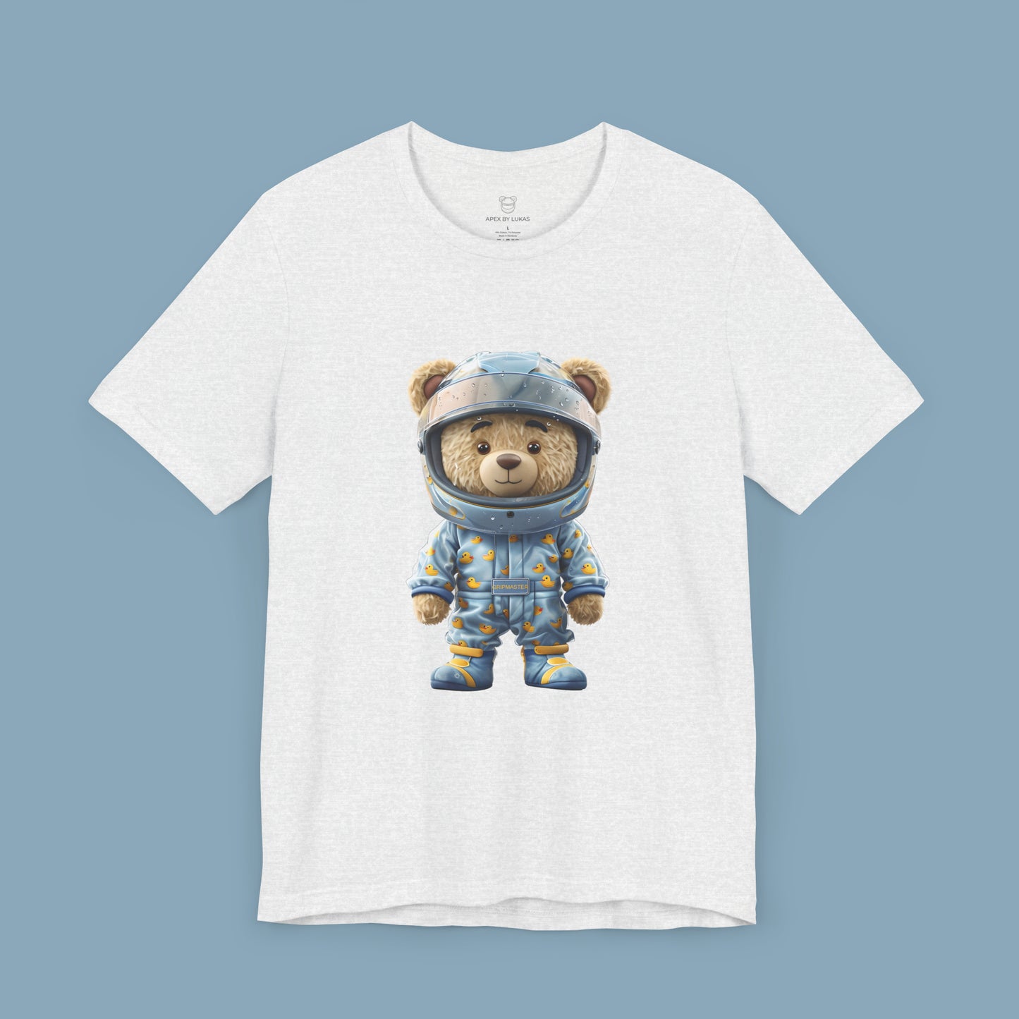 Grip Master teddy bear wearing a light blue karting racing suit with cute rubber duck pattern and light blue helmet on an ash color unisex streetwear t-shirt