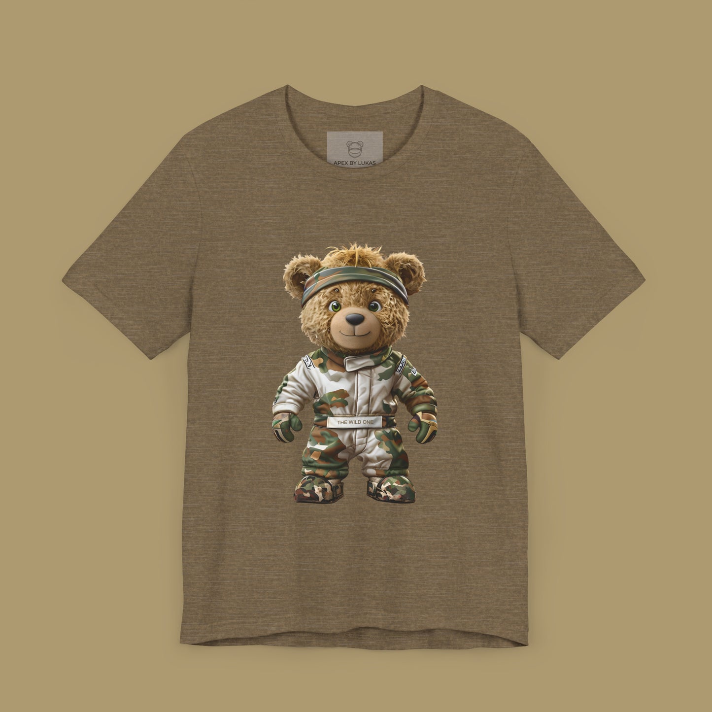 A teddy bear with messy hair wearing a military green racing suit with dirt patches and a bandana on a heather olive color unisex t-shirt