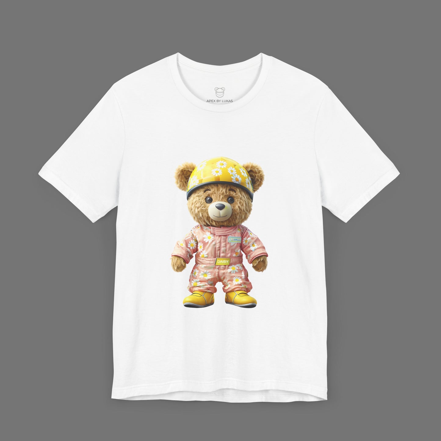Daisy teddy bear wearing a light pink karting racing suit with daisy floral pattern and yellow helmet on a white unisex streetwear t-shirt