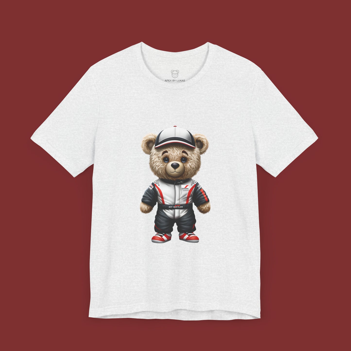 Serious yet cute Teddy Bear wearing a Haas look a like racing suit and a cap in white color with black and red accents on an ash unisext-shirt