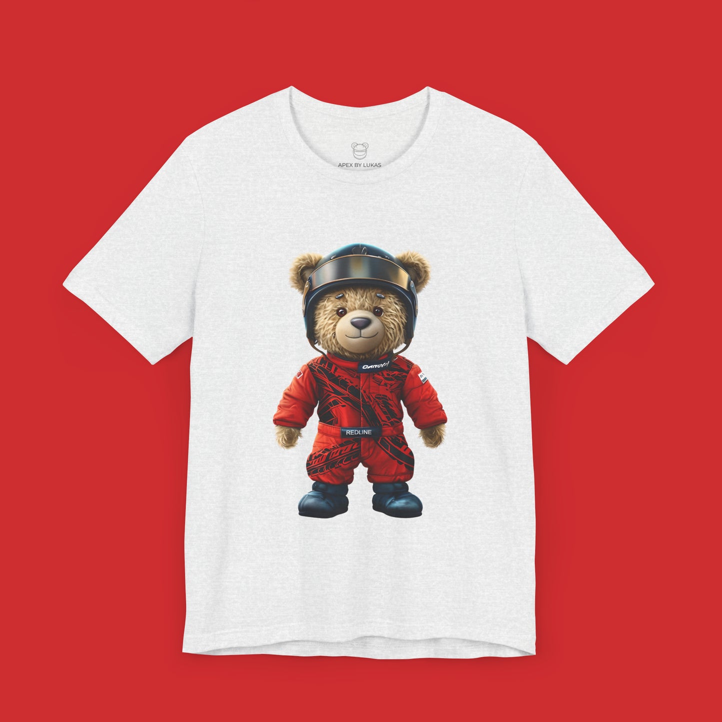 A teddy bear wearing a red karting racing suit with tyre marks, helmet and name patch "Redline" on an ash streetwear t-shirt