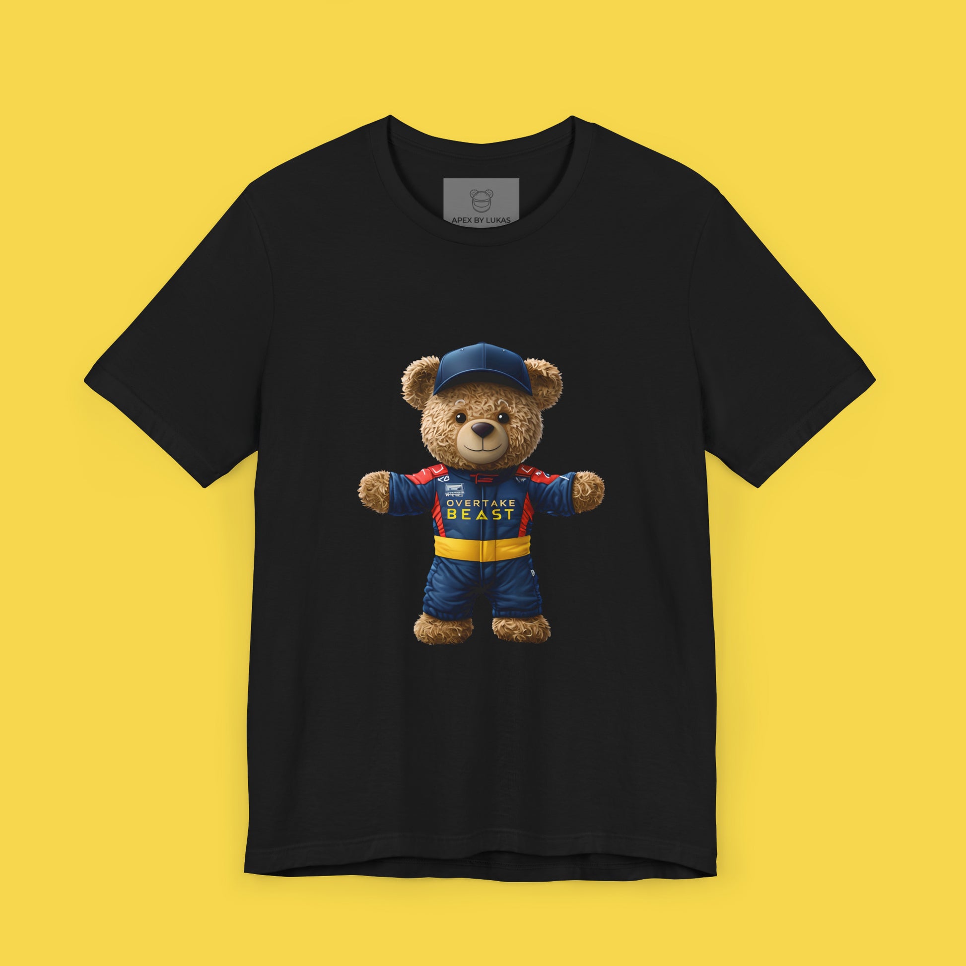 A confident teddy bear wearing Red Bull style racing suit and a dark blue cap on a black unisex t-shirt