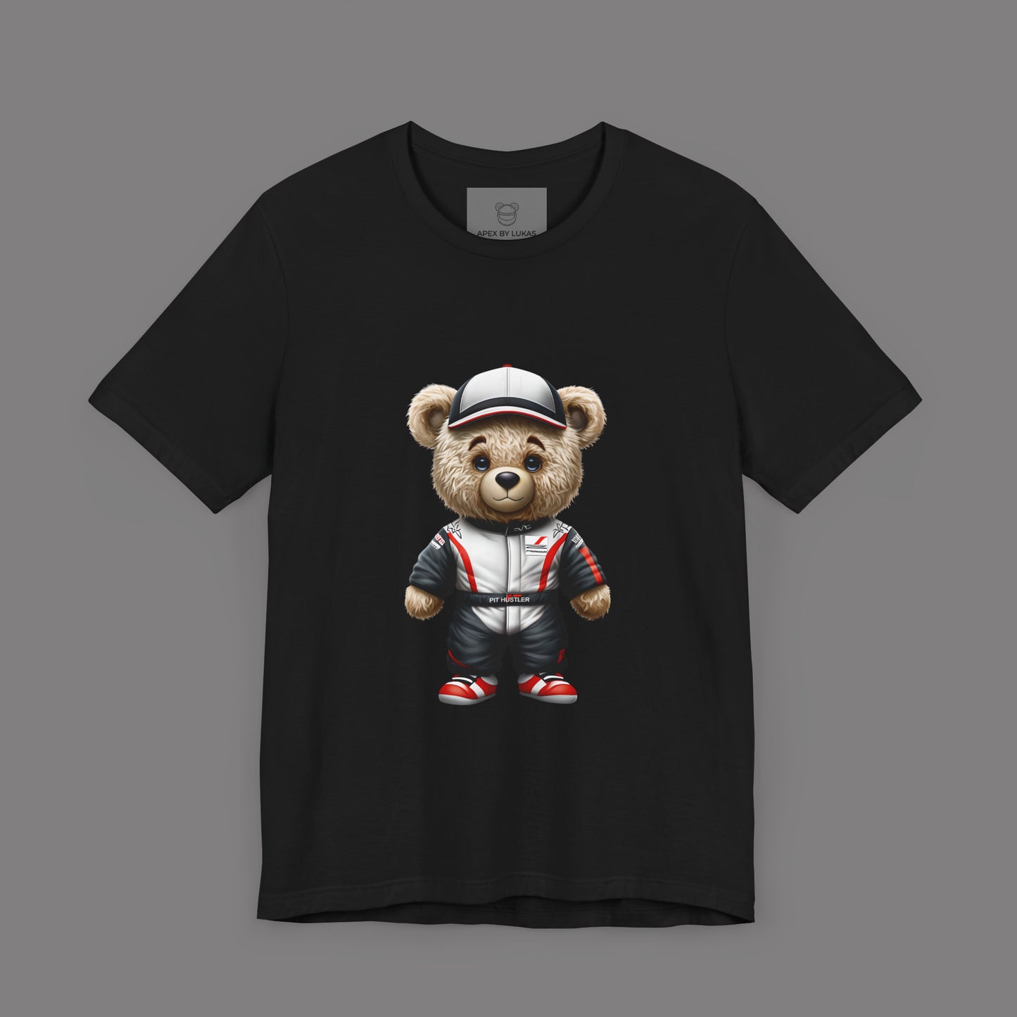 Serious yet cute Teddy Bear wearing a Haas look a like racing suit and a cap in white color with black and red accents on a black unisext-shirt