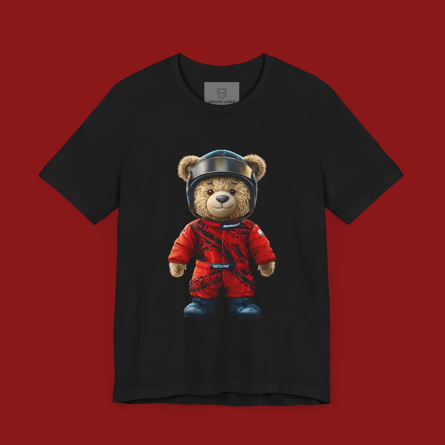 A teddy bear wearing a red karting racing suit with tyre marks, helmet and name patch "Redline" on a black streetwear t-shirt