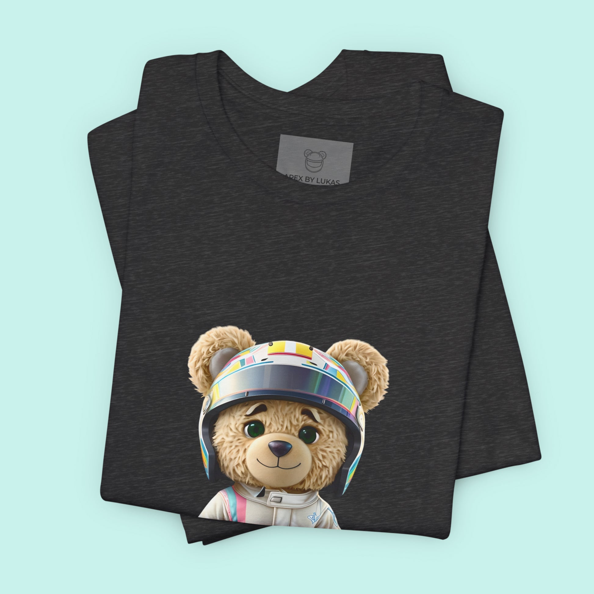 Teddy bear wearing a karting racing suit in beige color with light pink and blue lines on the side and a helmet on a dark grey heather color  t-shirt