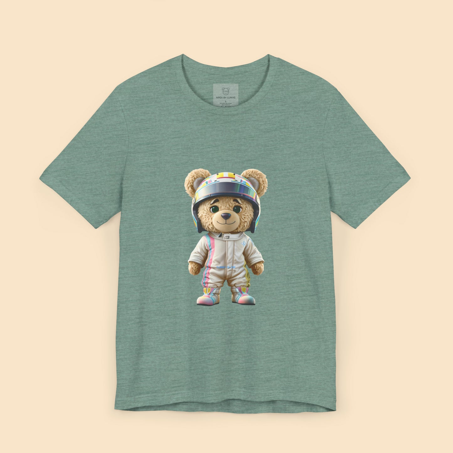 Teddy bear wearing a karting racing suit in beige color with light pink and blue lines on the side and a helmet on a heather dusty blue t-shirt