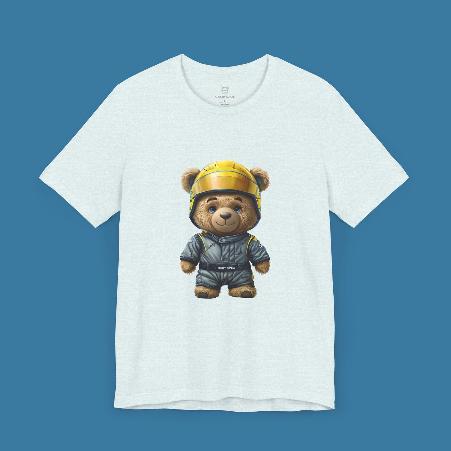 A rookie teddy bear wearing an oversized grey-blue karting racing suit and a yellow helmet on an ice blue color t-shirt